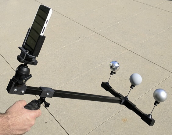 Capturing setup based on a smartphone and three spheres with varied materials to capture different light properties.